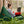 Load image into Gallery viewer, Ensemble Arico d&#39;un bean bag Junior XL avec un plateau coussin RICO. La photo est une femme travaillant sur son ordinateur sur le Bean bag avec son RICO. Vue d&#39;arrière. 
