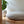 Load image into Gallery viewer, Coussin de sol Arico de couleur bouleau dans un décor maison. 
